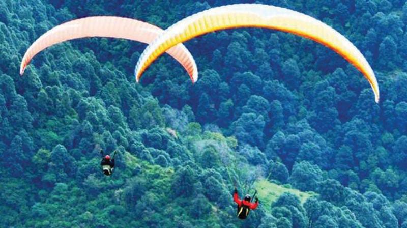 Paragliding adventure above a Kerala valley
